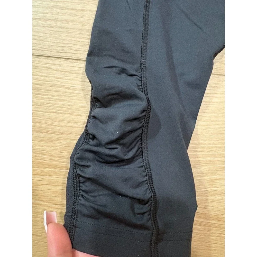 Lululemon Black Run Inspire Crop Leggings Ruched Mesh Size 4 Zipper Pocket Yoga
